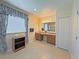 Bathroom with double sink vanity, large framed mirror, and blue decorative draperies at 110 No Name Key Dr, Deland, FL 32720