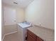Laundry room with washer, dryer, countertop, and white door at 110 No Name Key Dr, Deland, FL 32720