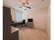 Functional home office with a large desk, natural light, and ample space for productivity and organization at 110 No Name Key Dr, Deland, FL 32720