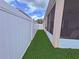 Fenced in side yard with grass and access gate to backyard at 110 No Name Key Dr, Deland, FL 32720
