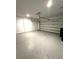 The spacious two-car garage features a remote-controlled door and ample room for parking and storage at 112 Lost Ball Dr, Daytona Beach, FL 32124