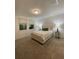 Relaxing main bedroom featuring a queen bed, stylish lamps, and soft carpet at 112 Lost Ball Dr, Daytona Beach, FL 32124