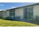 The rear exterior features a sliding glass door with views of the landscaped backyard at 112 Lost Ball Dr, Daytona Beach, FL 32124