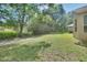 Lush backyard featuring mature trees and meticulously maintained lawn in a desirable location at 1125 Stillwater Dr, Deland, FL 32720