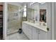 Modern bathroom featuring double sinks, walk-in shower, and ample storage at 1125 Stillwater Dr, Deland, FL 32720
