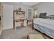 Bedroom featuring carpeted floors, a desk, and doorway leading into another room at 1125 Stillwater Dr, Deland, FL 32720
