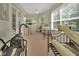 This bonus room features a desk, exercise equipment, and a view of the outdoors at 1125 Stillwater Dr, Deland, FL 32720