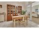 Cozy dining space featuring a classic wooden table and chairs, with ample storage at 1125 Stillwater Dr, Deland, FL 32720