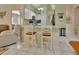 Modern kitchen with white cabinets, marble countertops, and breakfast bar seating at 1125 Stillwater Dr, Deland, FL 32720