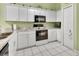 Efficient kitchen boasts white cabinetry, providing ample storage and workspace at 1125 Stillwater Dr, Deland, FL 32720