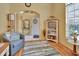 Inviting living room with cozy seating and a view to the front entry at 1125 Stillwater Dr, Deland, FL 32720
