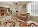Open-plan space blending living and dining areas under high ceilings with natural light at 1125 Stillwater Dr, Deland, FL 32720