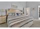 Serene main bedroom featuring a king bed, soft colors, and en-suite bath access at 1125 Stillwater Dr, Deland, FL 32720