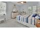 Bright bedroom featuring a serene decor, natural light and access to balcony at 1125 Stillwater Dr, Deland, FL 32720