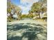 Well-maintained tennis court nestled within mature trees in a tranquil and desirable neighborhood at 1125 Stillwater Dr, Deland, FL 32720