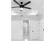 Hallway features a modern ceiling fan, white walls, tiled floors, and recessed lighting at 1163 W Hancock Dr, Deltona, FL 32725