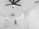 The spacious and bright living room features recessed lighting, ceiling fans, and flows seamlessly into other areas of the house at 1163 W Hancock Dr, Deltona, FL 32725
