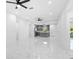 The spacious living room seamlessly connects to the kitchen, creating an open and airy atmosphere with lots of light at 1163 W Hancock Dr, Deltona, FL 32725