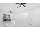 Bright and airy living space with recessed lighting, ceiling fans, white walls, and access to other rooms of the home at 1163 W Hancock Dr, Deltona, FL 32725