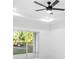 Bright living room featuring a modern ceiling fan and sliding glass doors to the outdoors at 1163 W Hancock Dr, Deltona, FL 32725
