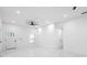 Living room features a modern ceiling fan, white walls, tiled floors, and recessed lighting at 1163 W Hancock Dr, Deltona, FL 32725