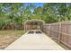 Extended parking and cover solution with a private fenced-in yard, offering both functionality and privacy at 1204 Lawrence Ave, Deltona, FL 32725