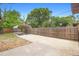 Spacious backyard with parking cover offering additional parking and recreational space at 1204 Lawrence Ave, Deltona, FL 32725
