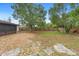 The backyard features a stone pathway and rock landscaping, creating a low-maintenance outdoor space at 1204 Lawrence Ave, Deltona, FL 32725