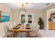 Elegant dining room with seating for six and access to an outdoor patio at 1204 Lawrence Ave, Deltona, FL 32725