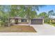 Attractive home showcasing a neat front yard and welcoming entrance, blending comfort and style at 1204 Lawrence Ave, Deltona, FL 32725