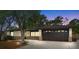 Charming single-story home featuring a large garage, brick accents, and mature trees at 1204 Lawrence Ave, Deltona, FL 32725