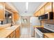 Bright kitchen with butcher block countertops, tile floors, and white appliances at 1204 Lawrence Ave, Deltona, FL 32725