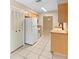 Charming kitchen with tile flooring, wooden cabinets and butcher block countertops at 1204 Lawrence Ave, Deltona, FL 32725