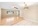 Spacious living room with hardwood floors, large window and open concept floor plan at 1204 Lawrence Ave, Deltona, FL 32725