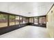 Inviting sunroom with multiple windows, perfect for relaxation and enjoying the outdoor view at 1204 Lawrence Ave, Deltona, FL 32725