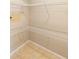 Walk-in closet with coated-wire shelving and tile floors at 1204 Lawrence Ave, Deltona, FL 32725