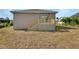 New wooden deck and stairs lead from back of home to yard at 1226 North St, Daytona Beach, FL 32114