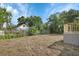 An ample backyard with a newly built deck with stairs at 1226 North St, Daytona Beach, FL 32114