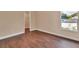 Bedroom with wood floors, neutral paint, and window providing natural light at 1226 North St, Daytona Beach, FL 32114