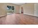 Spacious bedroom with wood floors and large glass sliding door to outdoor living space at 1226 North St, Daytona Beach, FL 32114