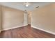 Bedroom features wood floors, neutral paint, ceiling fan, and walk in closet at 1226 North St, Daytona Beach, FL 32114