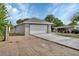 A two car garage with a freshly poured long concrete driveway at 1226 North St, Daytona Beach, FL 32114