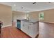 Kitchen island with granite countertop, stainless steel dishwasher and open to living area at 1226 North St, Daytona Beach, FL 32114
