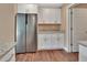 Well-lit kitchen featuring stainless steel appliances, granite counters, and white cabinetry at 1226 North St, Daytona Beach, FL 32114