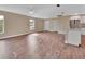 Bright open living space showcasing hardwood floors, a kitchen view and natural light at 1226 North St, Daytona Beach, FL 32114