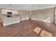 Open-concept living space with hardwood floors and a view into the kitchen area at 1226 North St, Daytona Beach, FL 32114