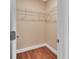 A walk-in closet with wood flooring and built in wire shelving at 1226 North St, Daytona Beach, FL 32114