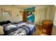 Unique bedroom with a hand painted wall mural, closet, hardwood floors and bright natural lighting at 1301 Killian St, Daytona Beach, FL 32114