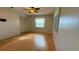 Light-filled bedroom features hardwood floors, a window, and a closet at 1301 Killian St, Daytona Beach, FL 32114