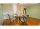 Cozy breakfast nook featuring a glass table and four cushioned chairs, perfect for casual dining at 1301 Killian St, Daytona Beach, FL 32114